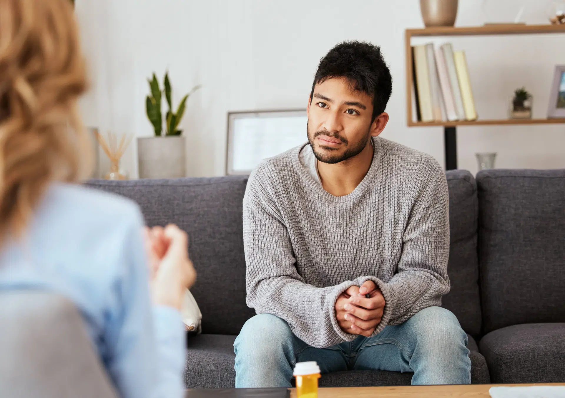 Man consults with therapist on couch